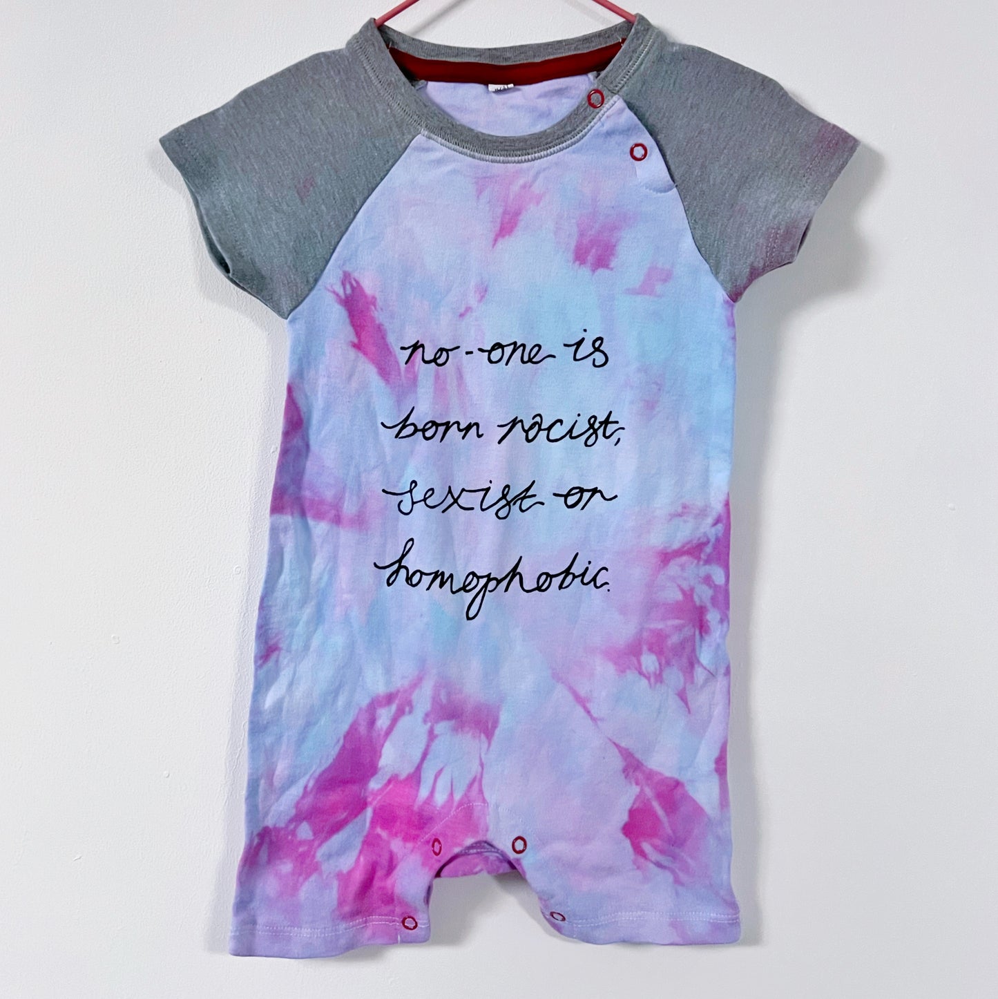 hate is taught... tie dye baby bodysuit