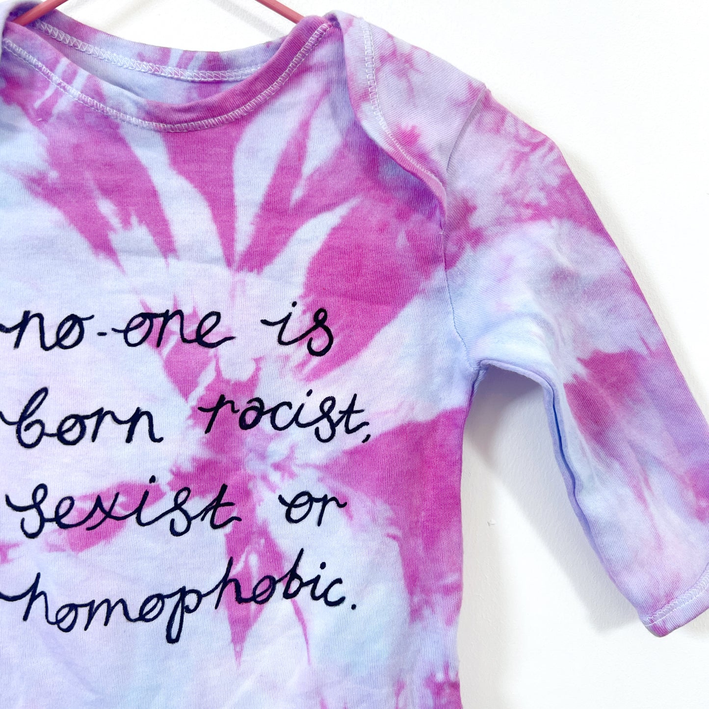 hate is taught tie dye baby grow