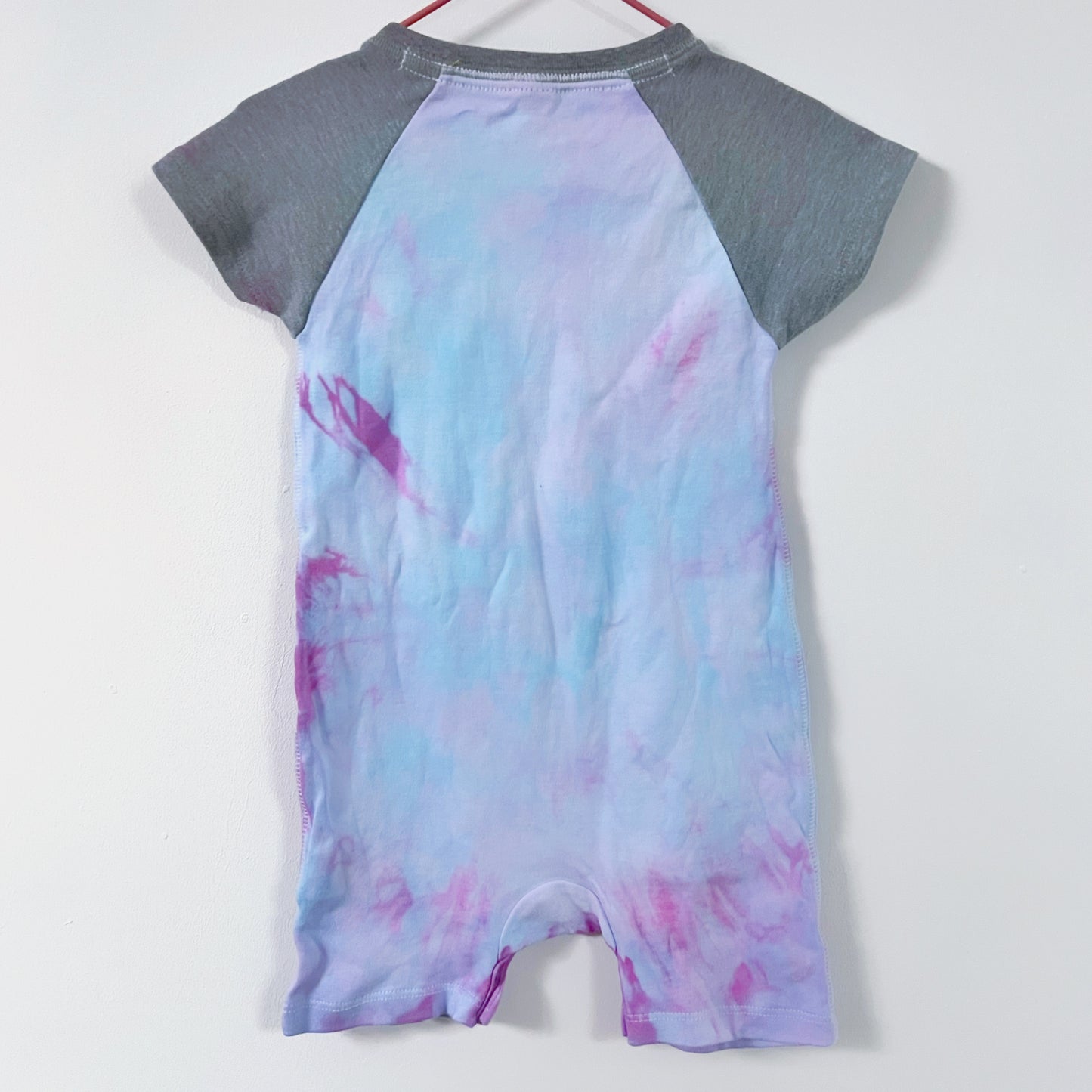 hate is taught... tie dye baby bodysuit